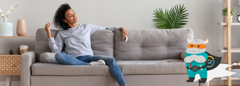 Person sitting on a couch inside