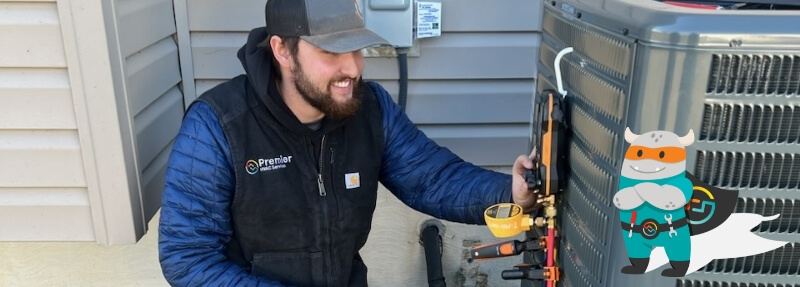 Premier HVAC technician working on an AC unit