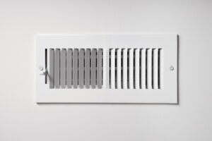 heating-and-cooling-vent-on-white-wall