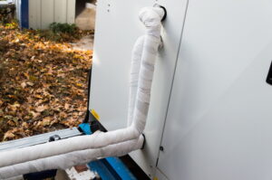 refrigerant-line-behind-air-conditioner
